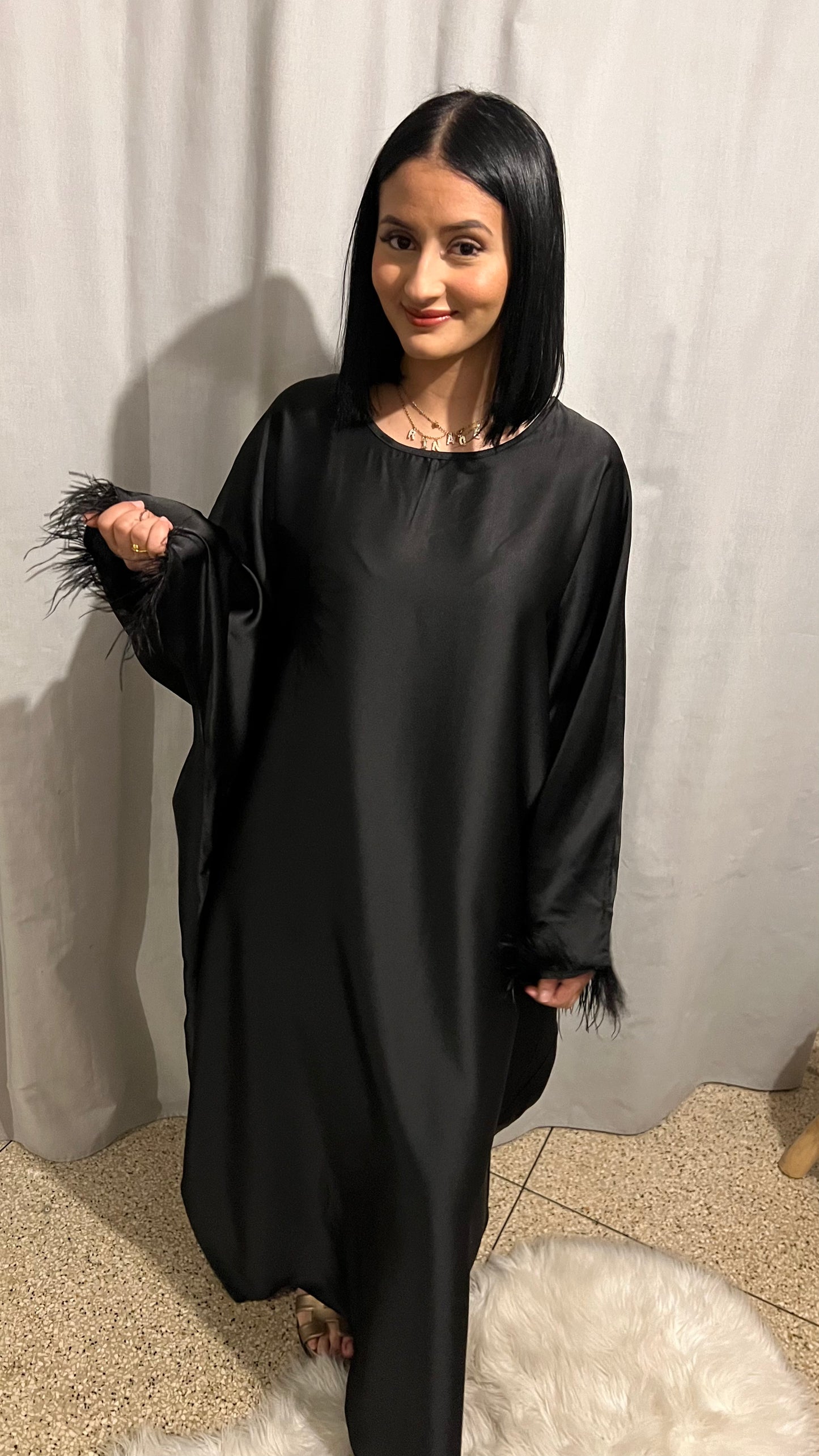 Robe à plumes ample